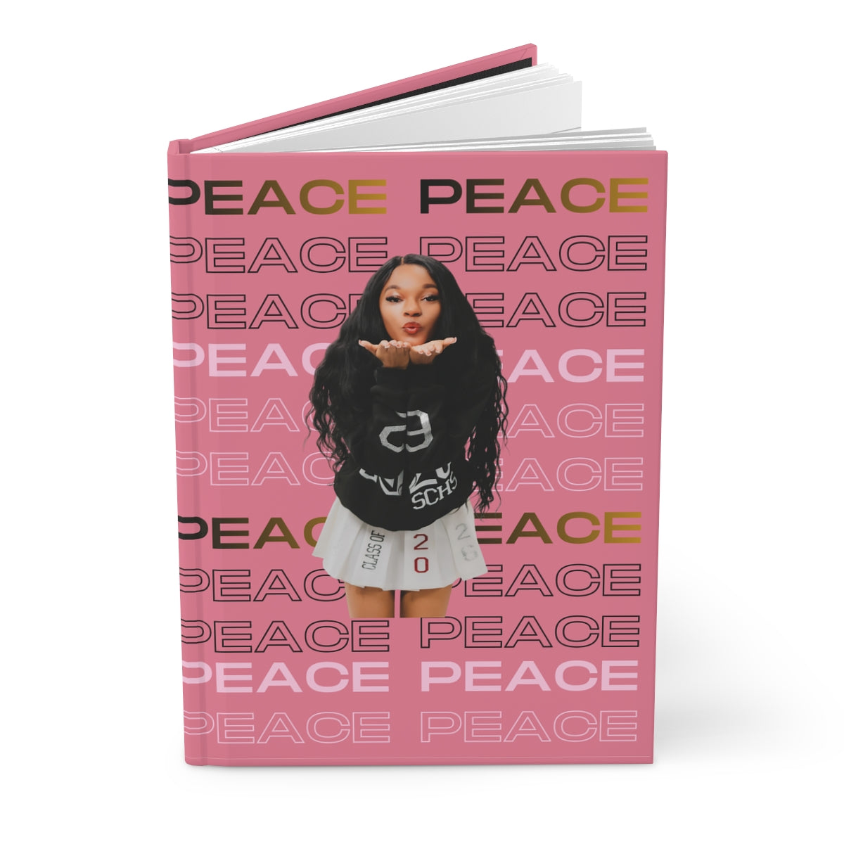 Peace Journal with pink cover featuring repeated "PEACE" text and a playful graphic design.