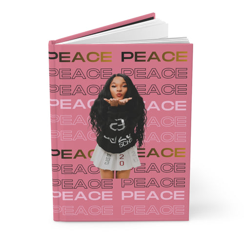 Peace Journal with pink cover featuring repeated "PEACE" text and a playful graphic design.