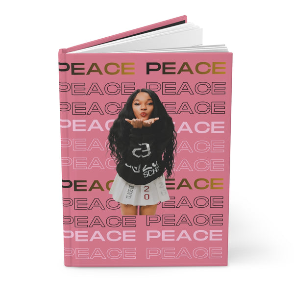 Peace Journal with pink cover featuring repeated "PEACE" text and a playful graphic design.